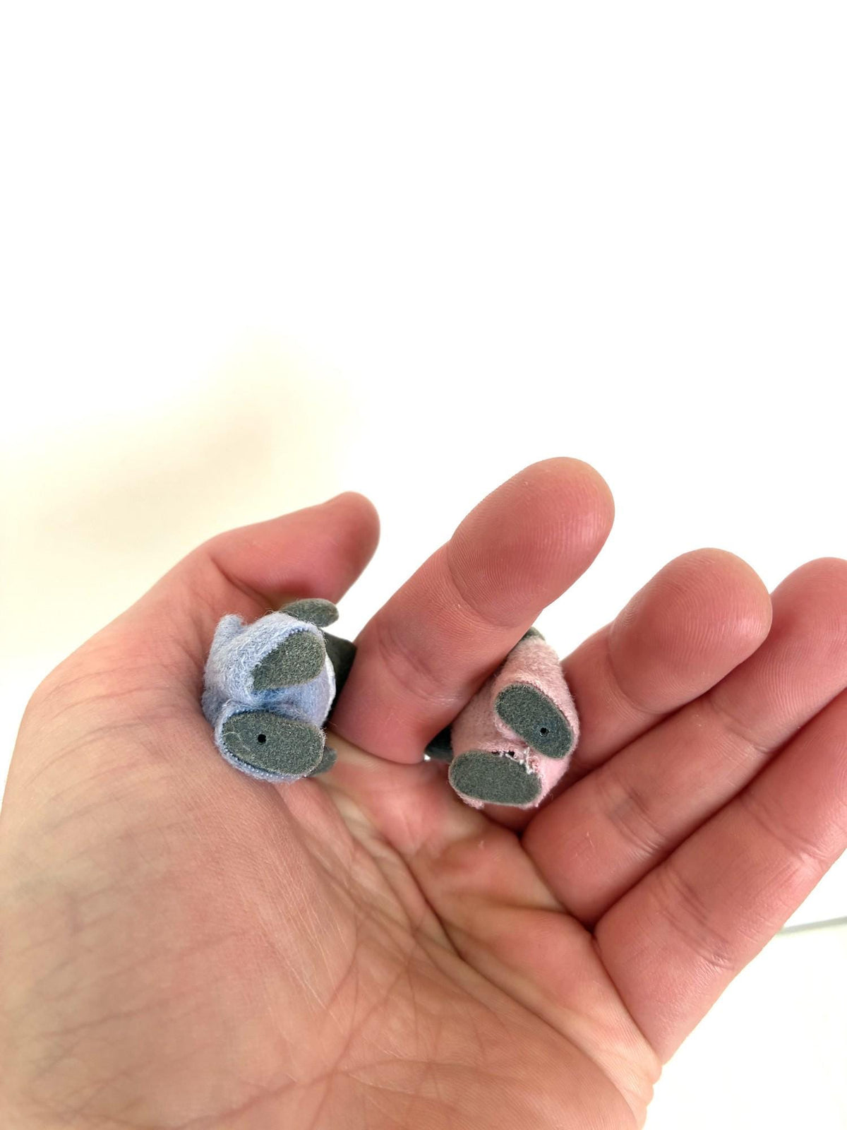 Calico Critters Sylvanian Families grey mouse babies held in hand for scale