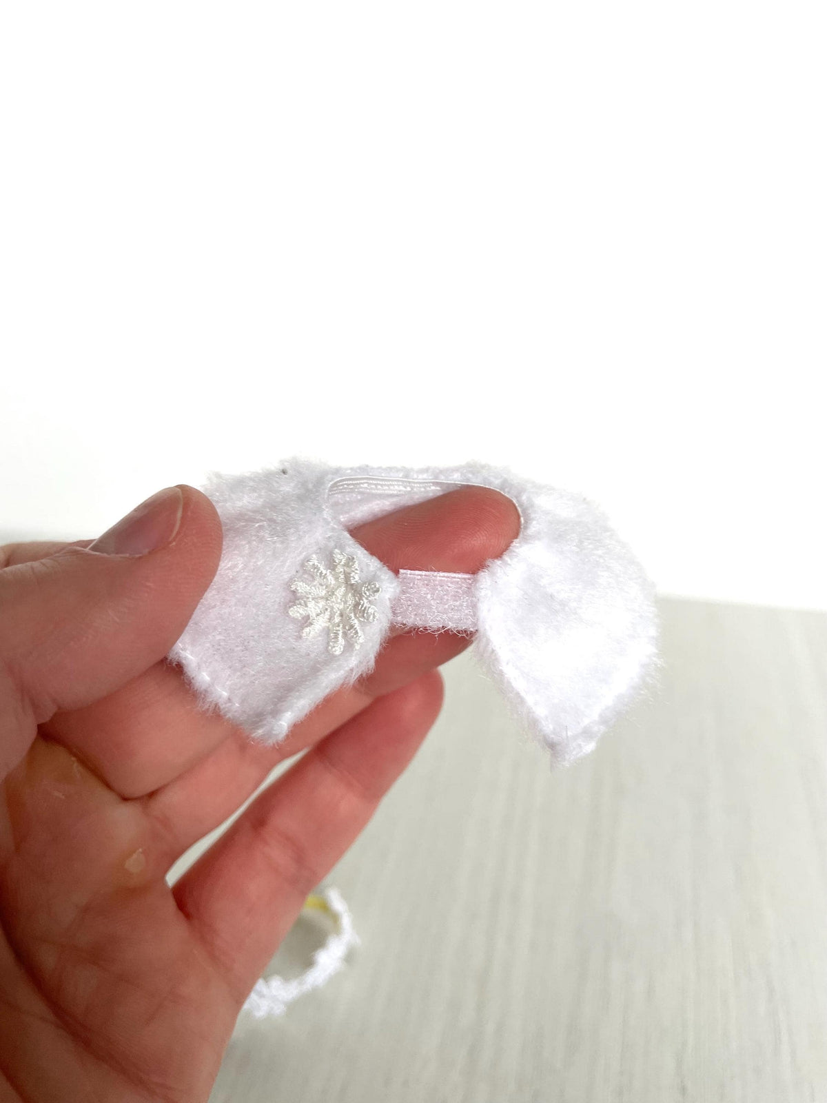 Close-up of white fleece snowflake shawl for Calico Critters and Sylvanian Families critters