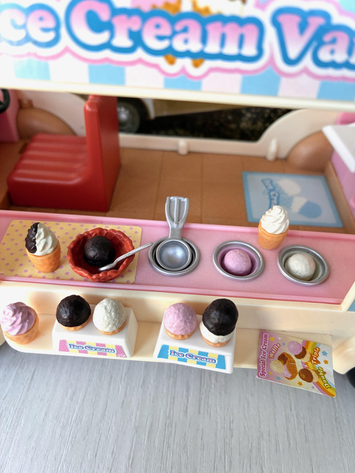 Sylvanian Families Calico Critters Ice Cream Van (Flair 4791) close-up of the serving counter with cone ice creams, waffle bowl and scoop