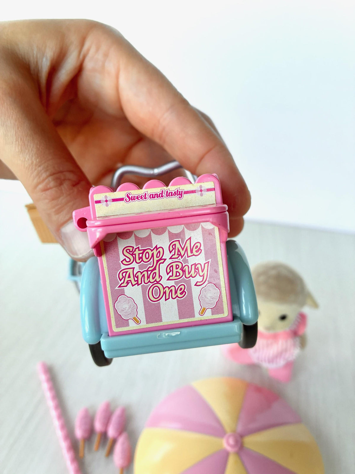 Sylvanian Families Calico Critters Dolly's Candy Floss (Flair 4678) candy floss cart front sign close-up held in hand
