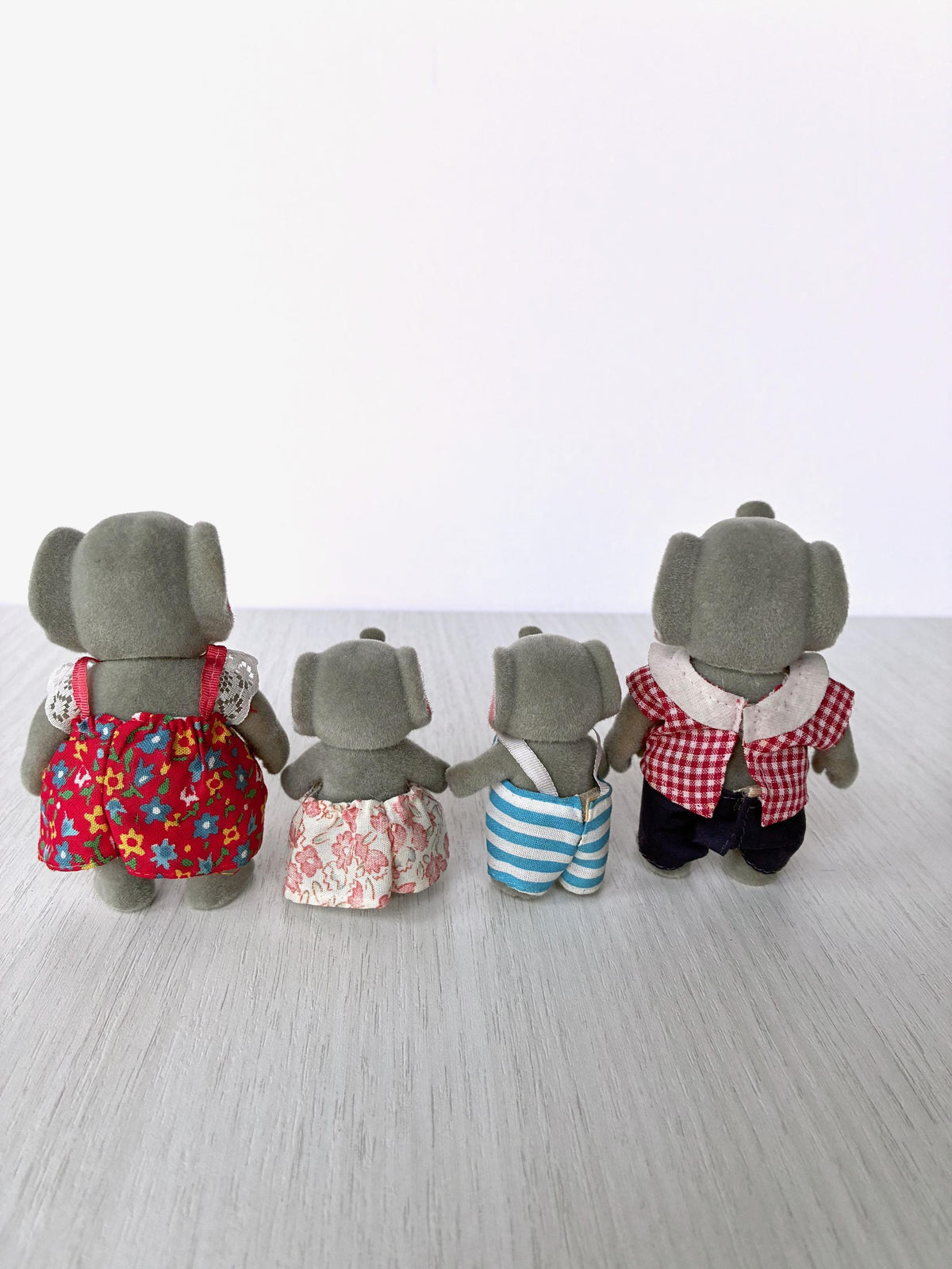 Back view of the vintage Forest Families elephant family showing clean flocking and outfits