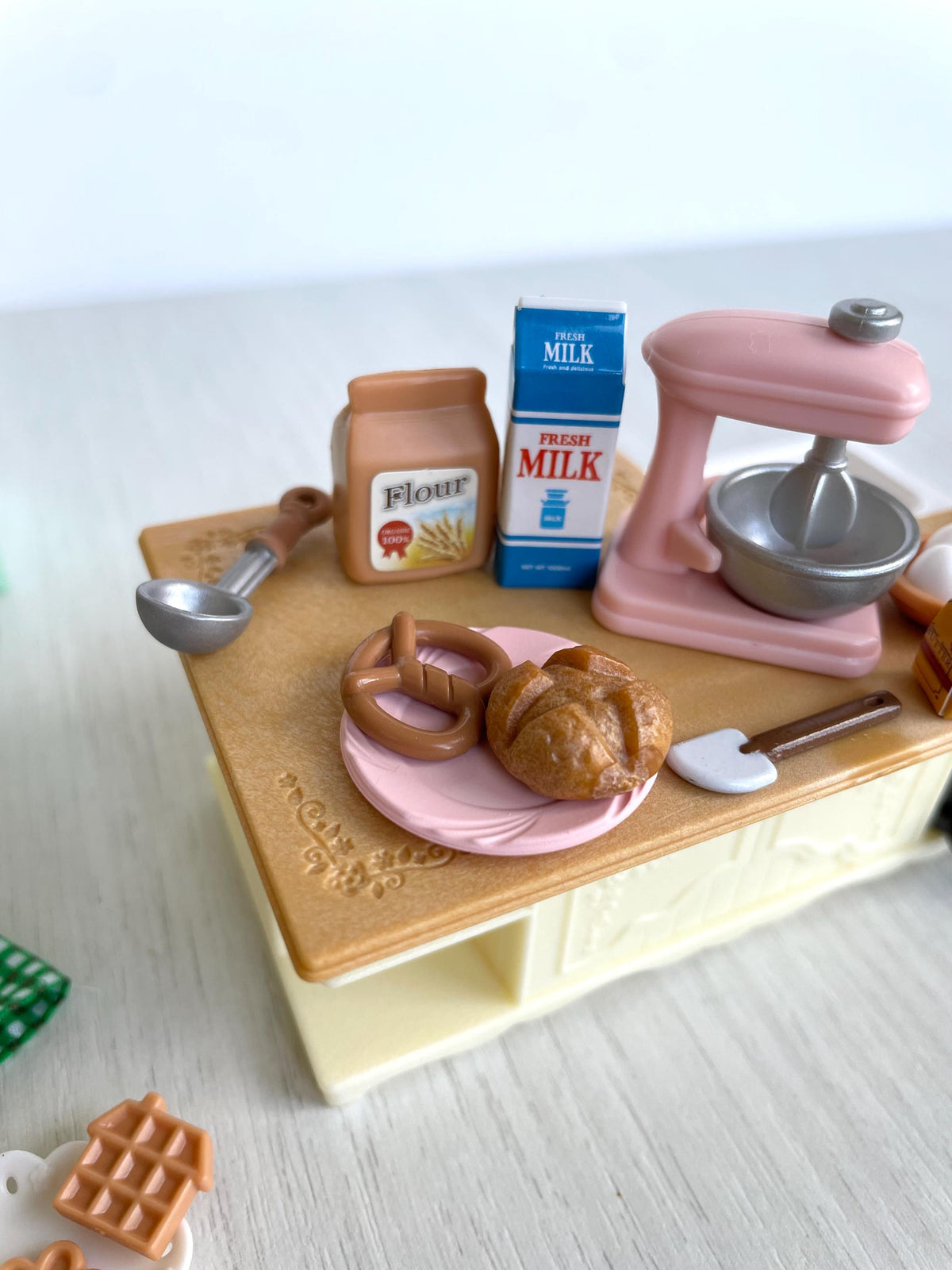 Close-up of the prep island with flour, milk, pretzel, bread roll and pink stand mixer — Calico Critters and Sylvanian Families