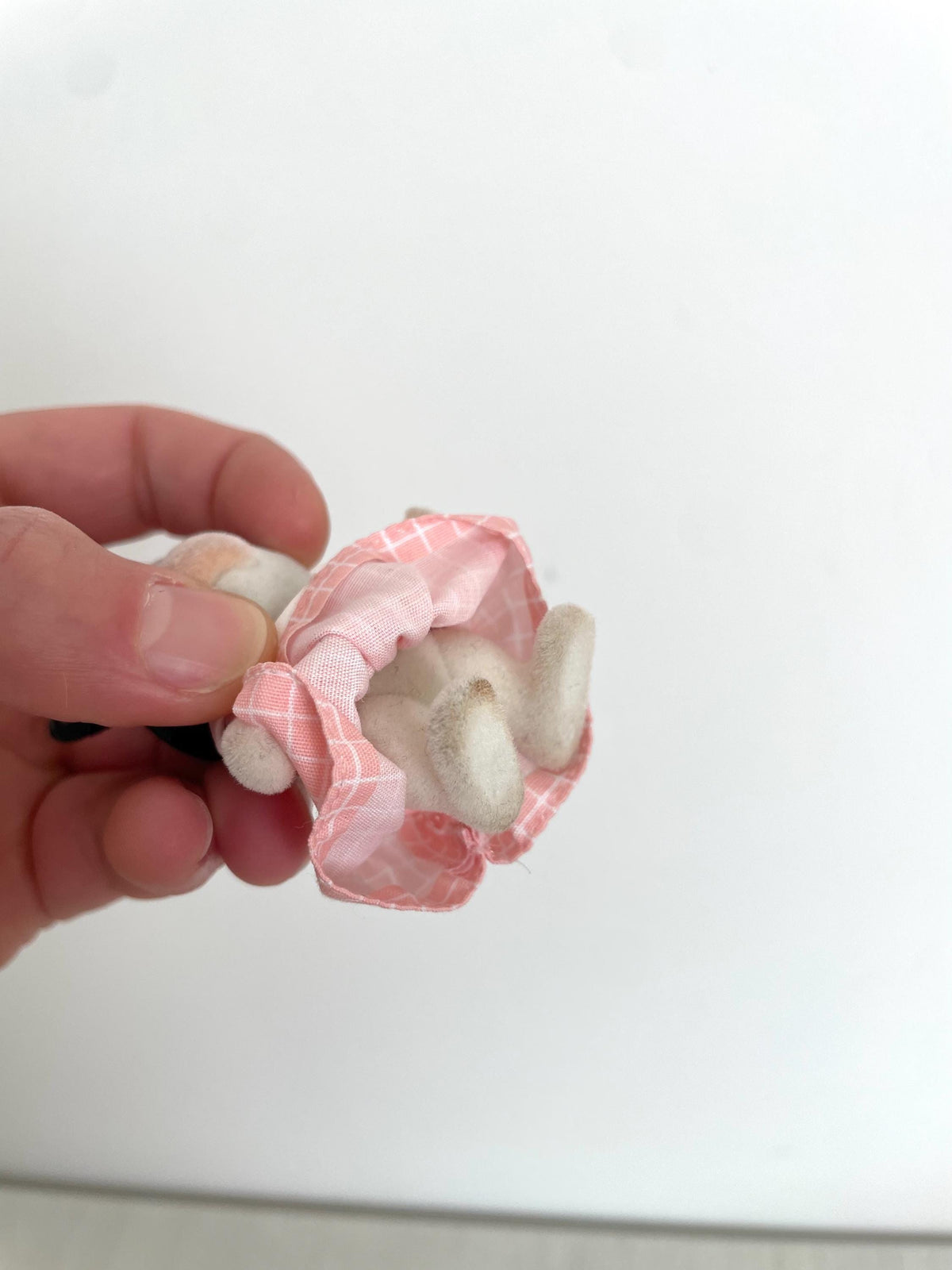 Close-up of the cow girl removed pink check dress showing the fabric and lining — Calico Critters and Sylvanian Families