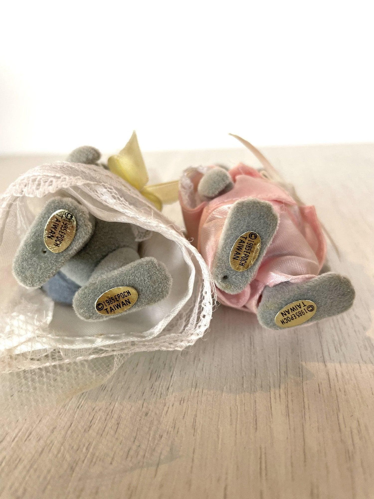 Detail of the gold foil stickers on the feet of the vintage Tomy rabbit figures — Calico Critters and Sylvanian Families