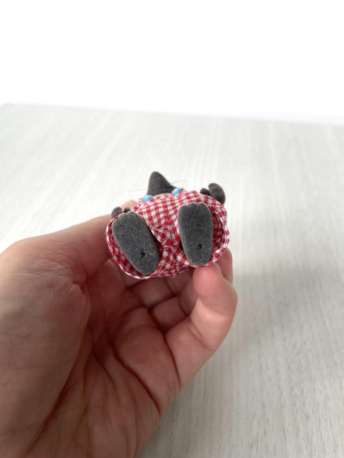 Underside of the mole dad's feet showing the base — Calico Critters and Sylvanian Families