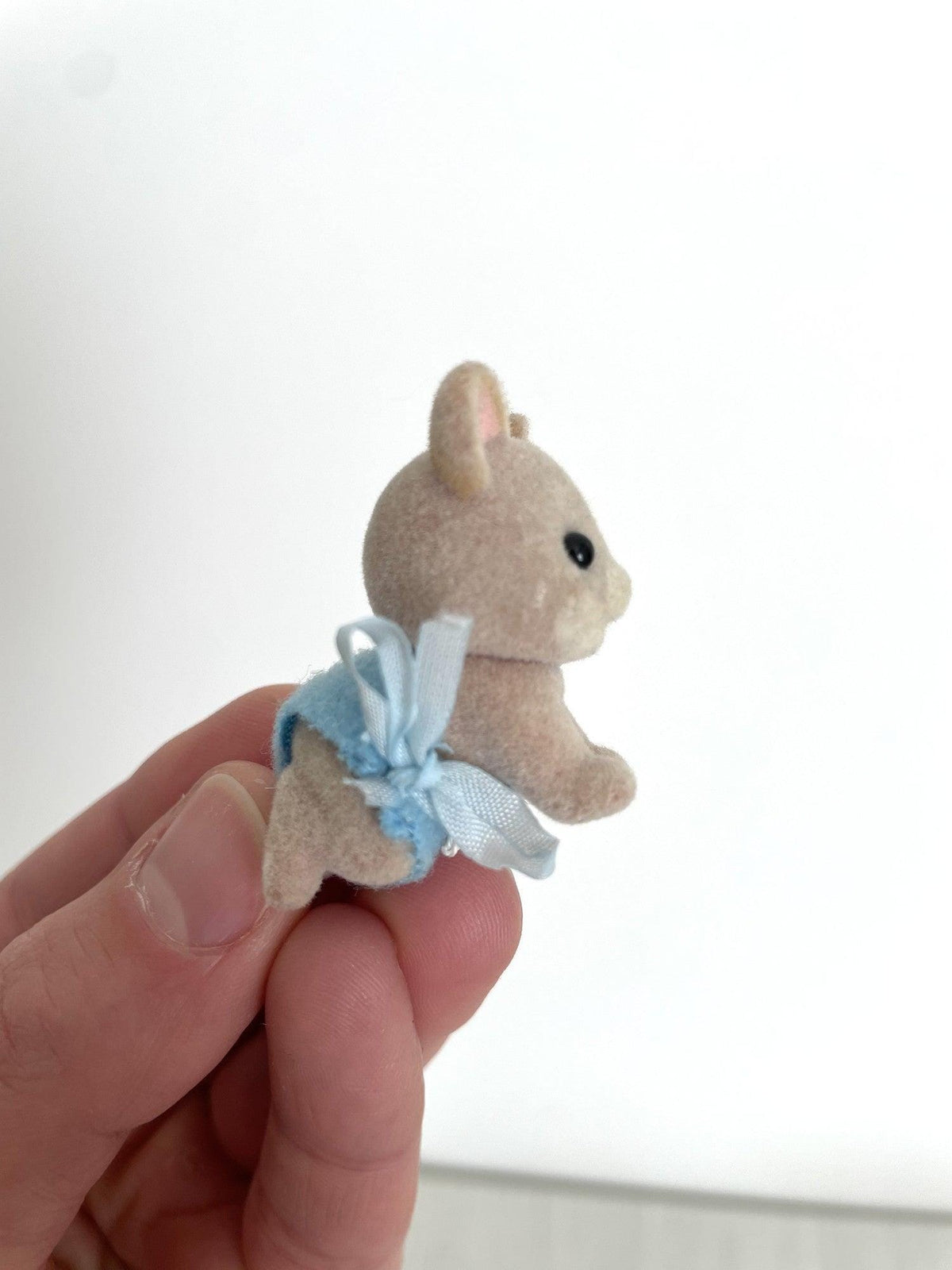 Side view of the Maces Mouse baby boy showing the lace trim and bow — Calico Critters and Sylvanian Families