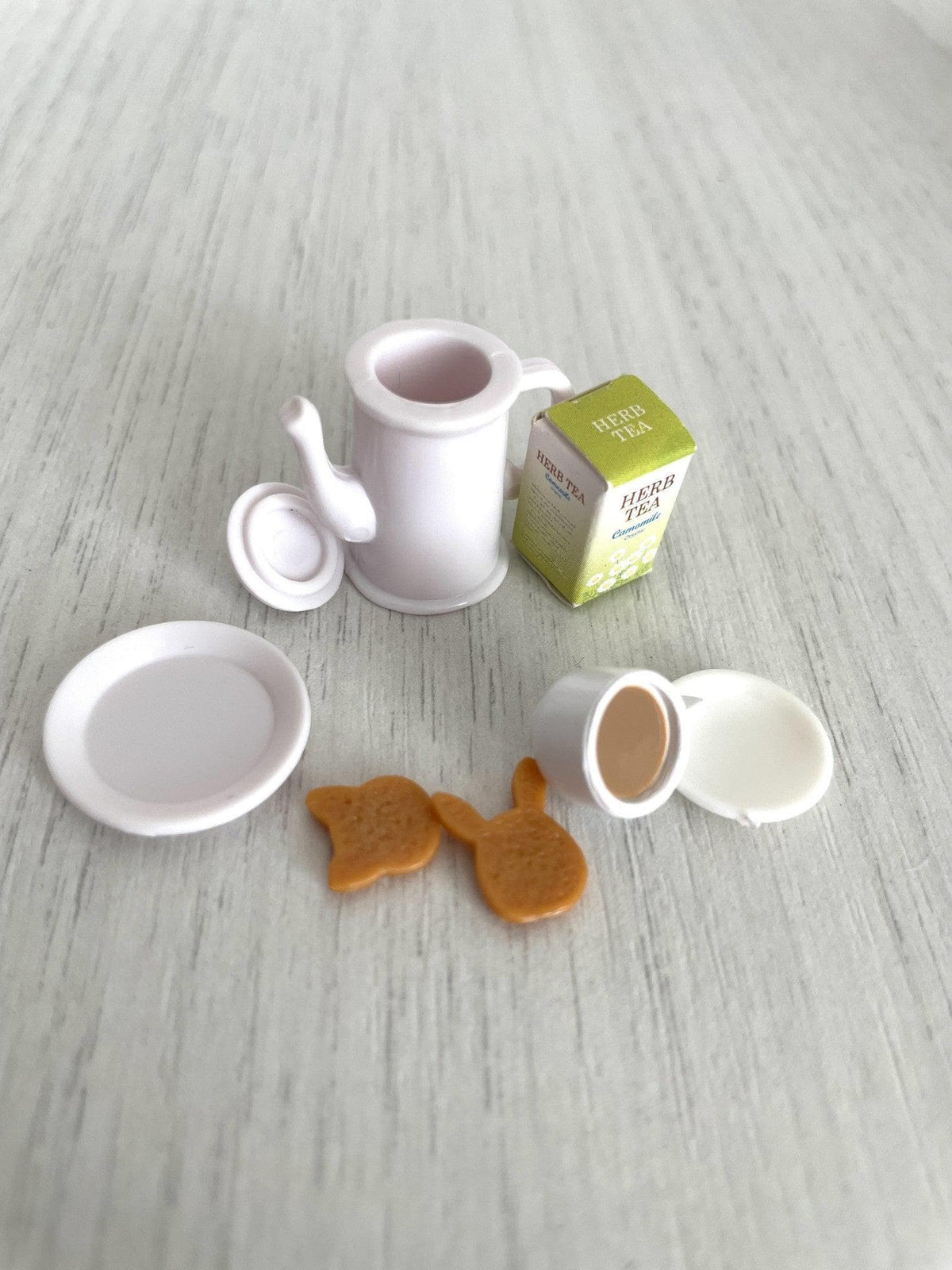 All tea set pieces separated, with the coffee pot lid removed — Calico Critters and Sylvanian Families