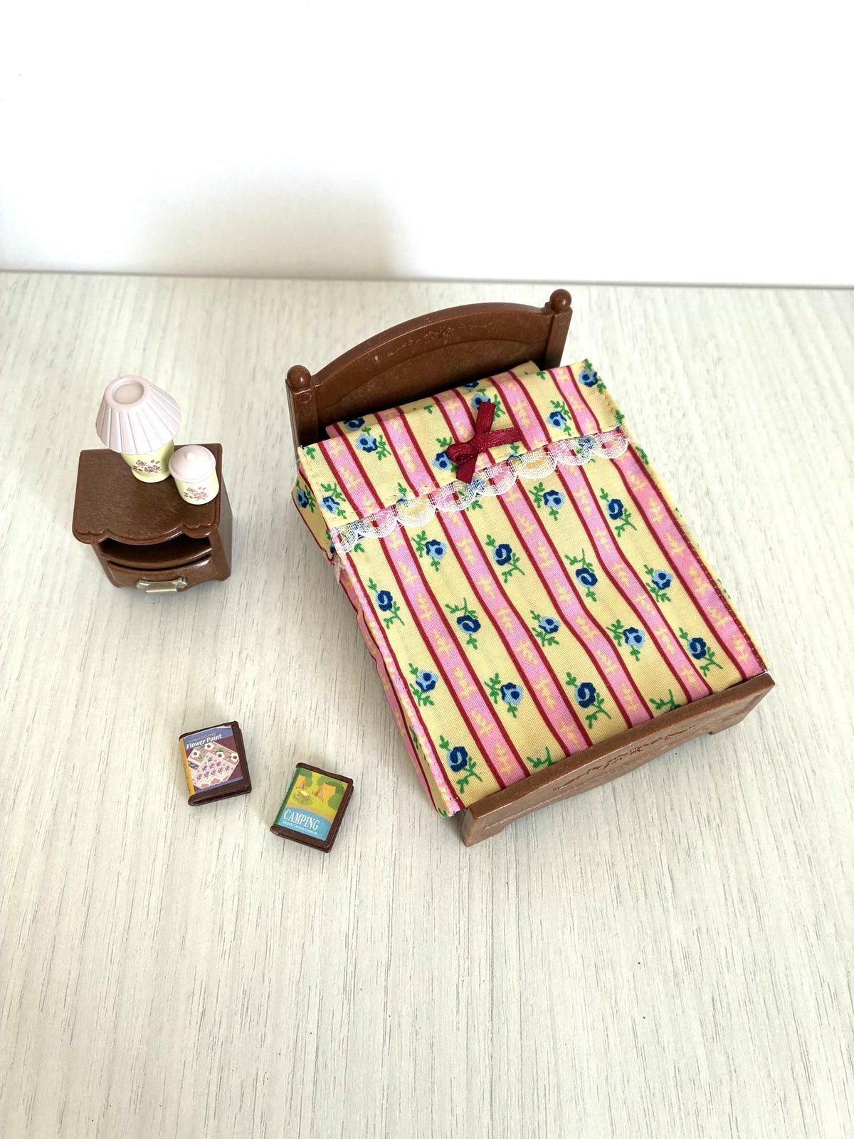 Calico Critters Sylvanian Families dollhouse double bed and bedside table from above