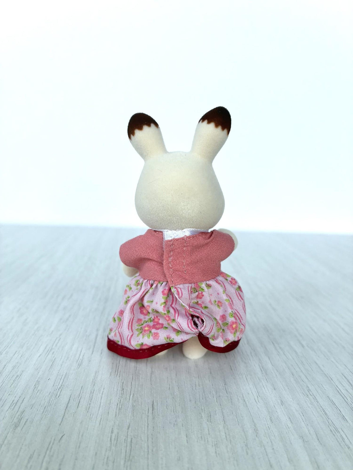 Calico Critters Sylvanian Families Hopscotch Chocolate rabbit mother in pink floral dress with bow, back view