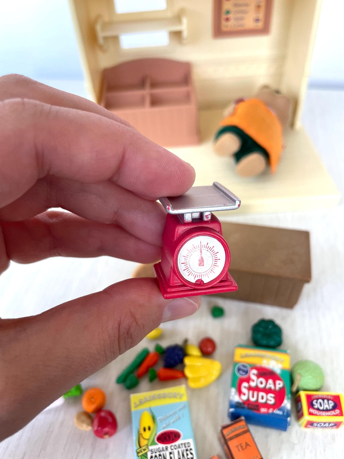Red weighing scales from the Sylvanian Families J. Sainsbury Grocery Shop, Calico Critters miniature