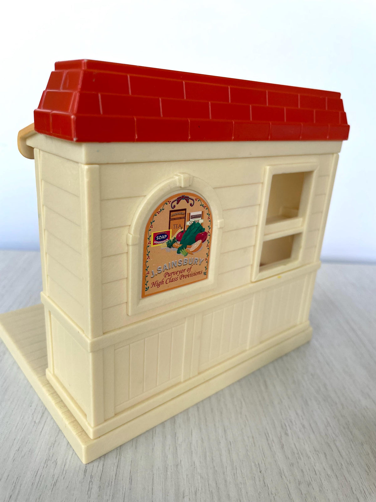 Side of the J. Sainsbury shop showing the Purveyor of High Class Provisions panel, Sylvanian Families Calico Critters