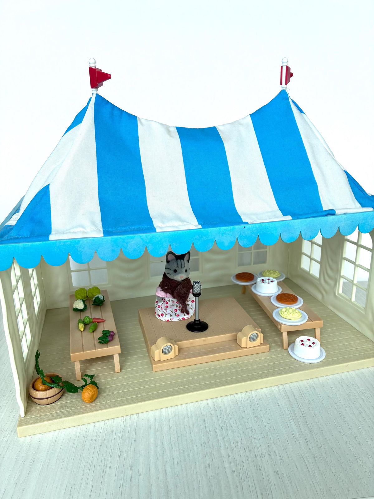 Calico Critters Sylvanian Families Marquee interior with stage, microphone and both show tables set up
