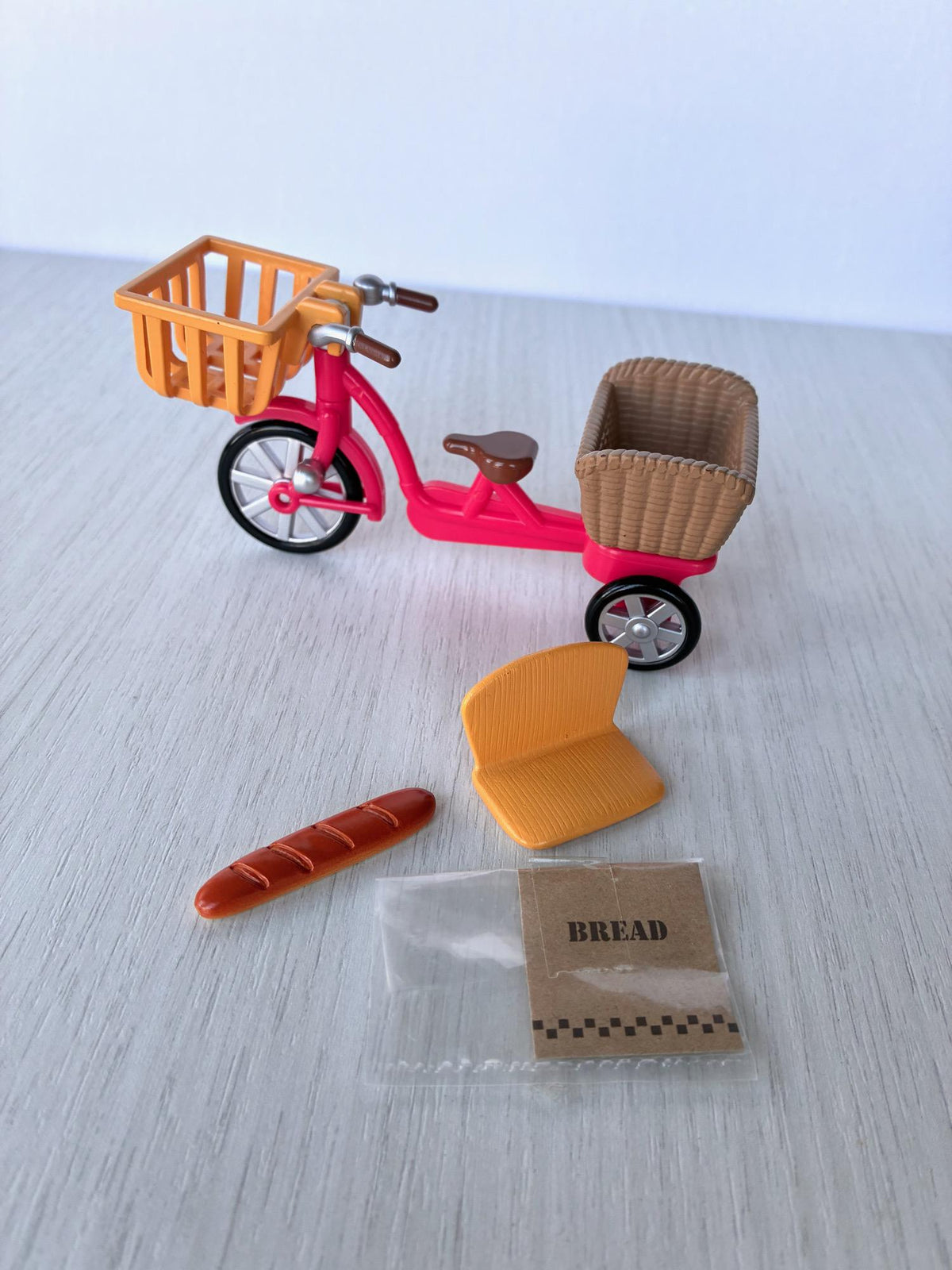 Sylvanian Families Calico Critters red bicycle with orange front basket, rear basket, child seat, baguette and bread bag – photo 4 of 8