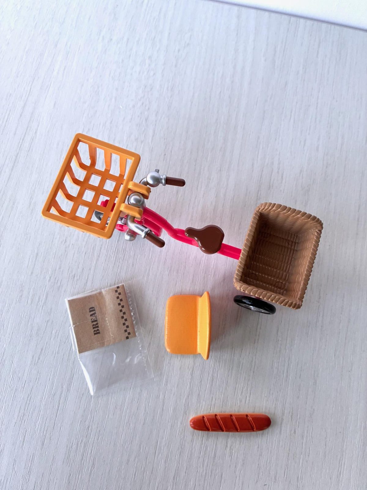 Sylvanian Families Calico Critters red bicycle with orange front basket, rear basket, child seat, baguette and bread bag – photo 6 of 8