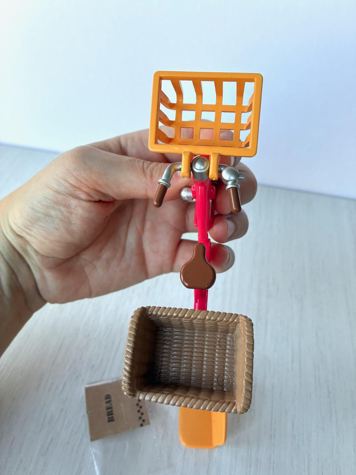 Sylvanian Families Calico Critters red bicycle with orange front basket, rear basket, child seat, baguette and bread bag – photo 7 of 8