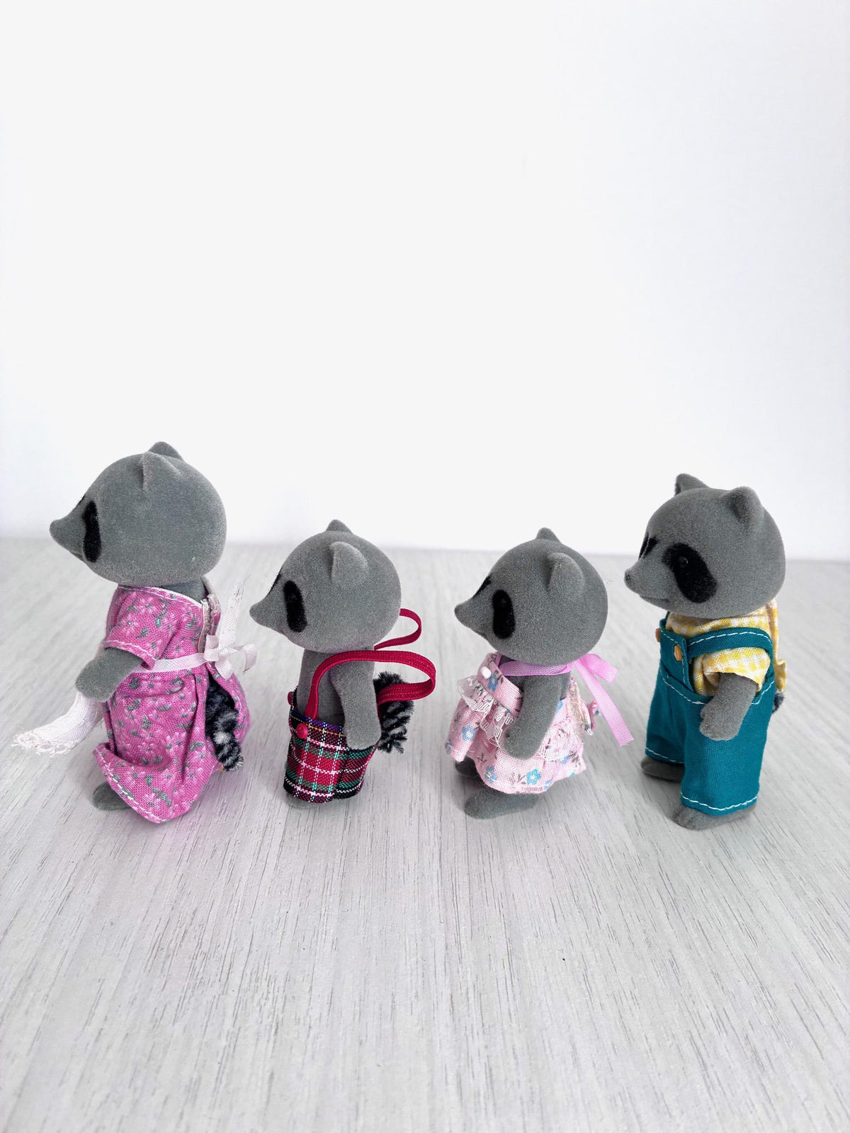 Calico Critters Sylvanian Families vintage Chestnut Raccoon family of 4, back view close up of mother and brother figures