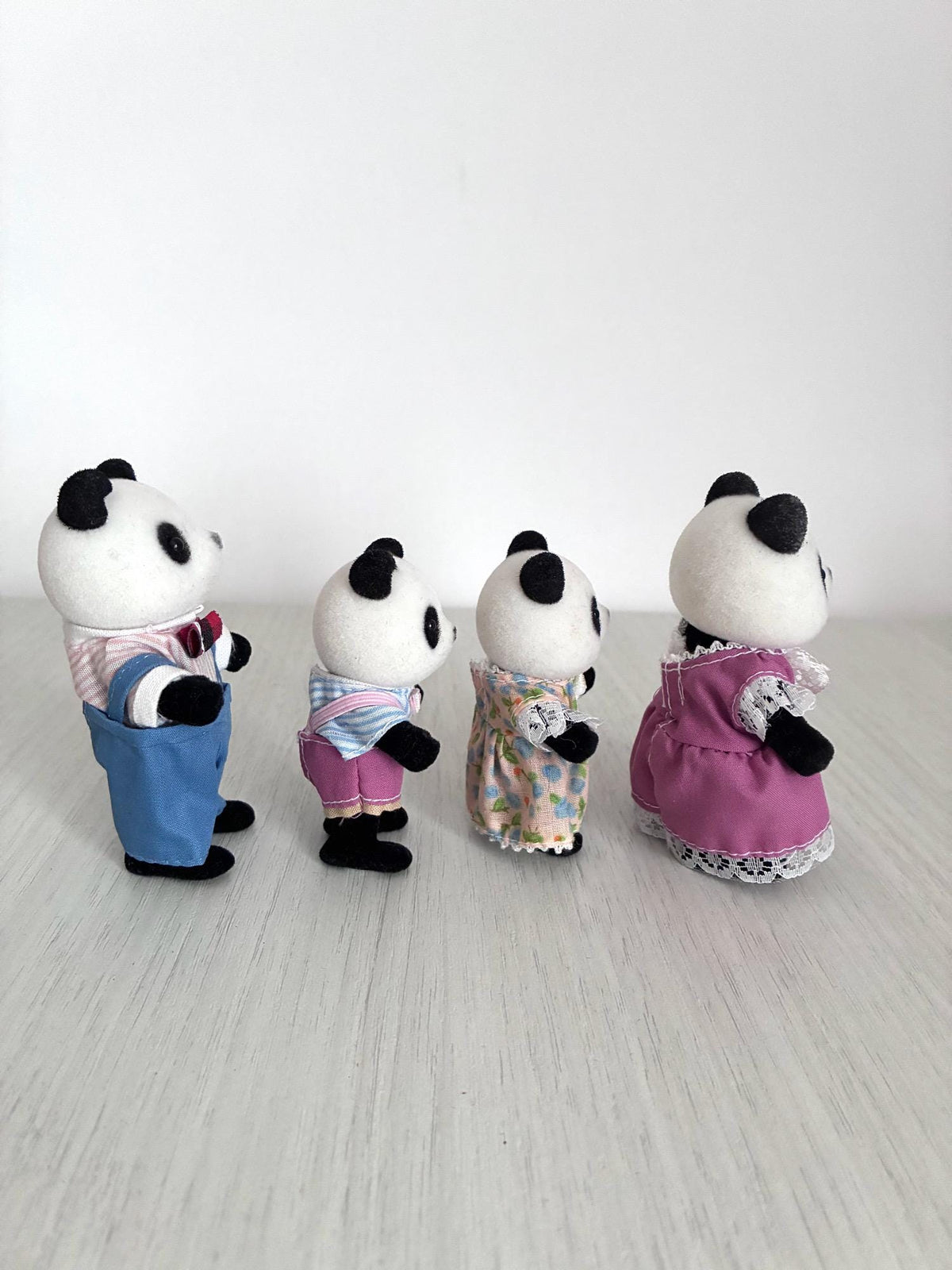 Calico Critters Sylvanian Families vintage Bamboo Panda family of 4, back view of all four figures showing flocking condition
