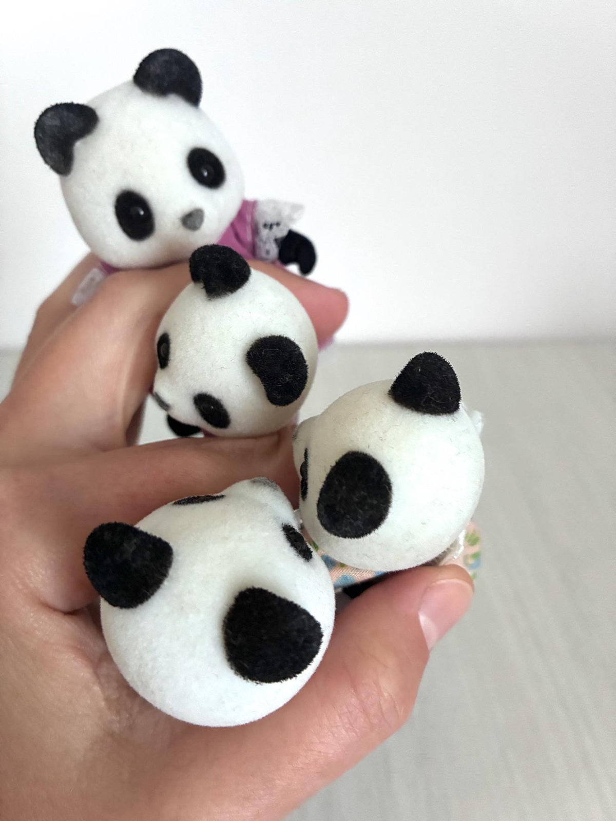Calico Critters Sylvanian Families vintage Bamboo Panda family of 4, close up of mother figure face in hand