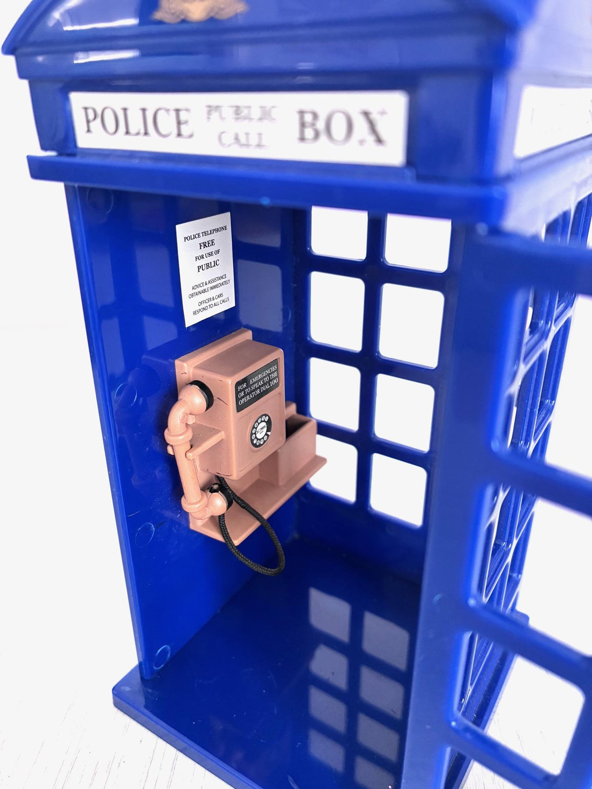 Interior of Sylvanian Families Police Call Box showing telephone and notice sign, Calico Critters vintage accessory detail