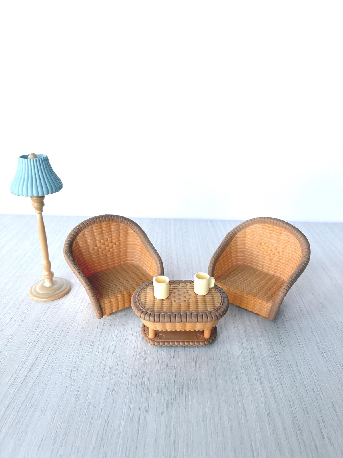 Sylvanian Families Calico Critters wicker armchairs, oval wicker coffee table, blue floor lamp and cream mugs – photo 1 of 9, from the Family Room with Aquarium set