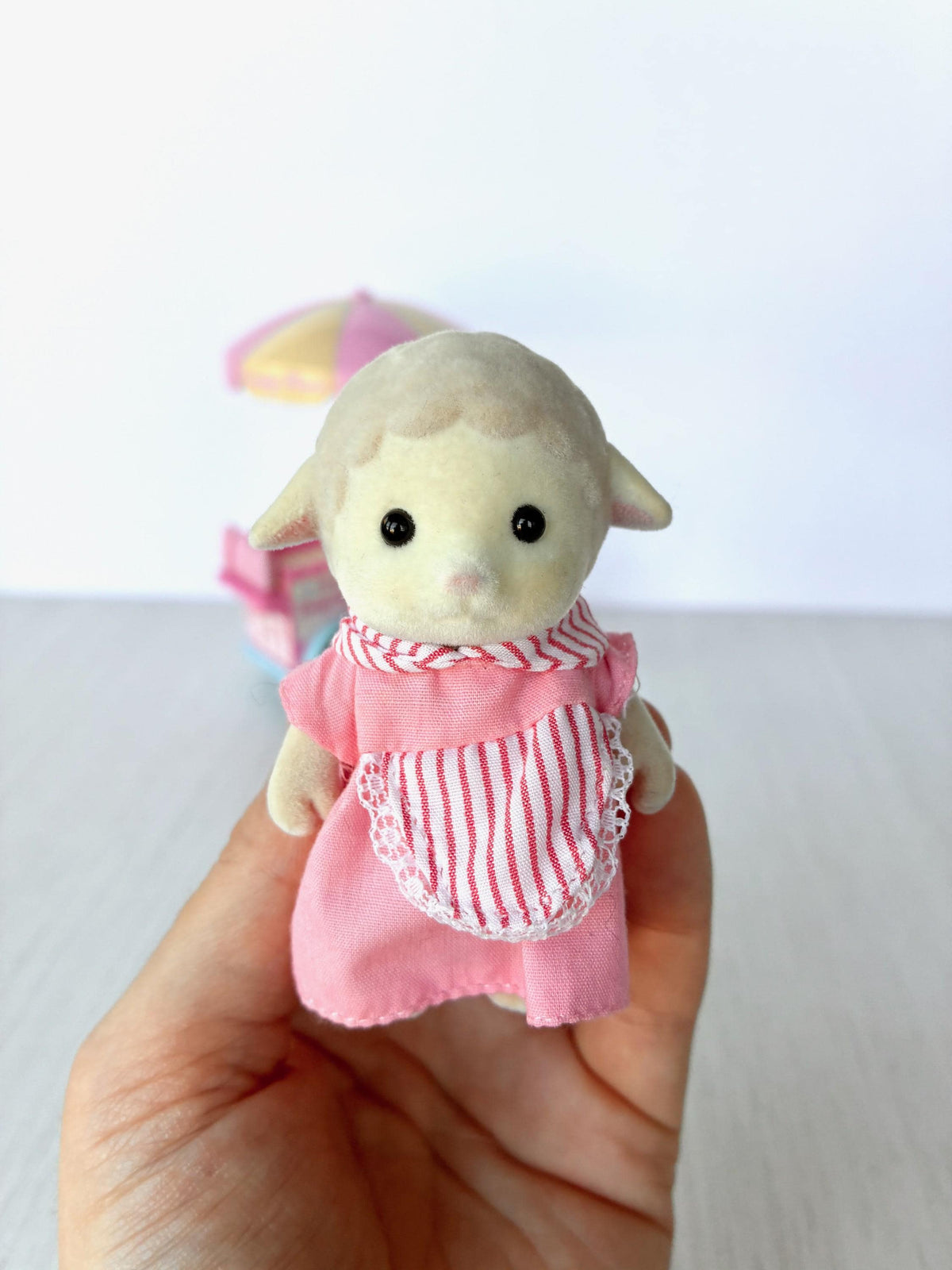 Sylvanian Families Calico Critters Dolly's Candy Floss (Flair 4678) Dolly Dale sheep figure held in hand, front view showing clean flocking and bright eyes