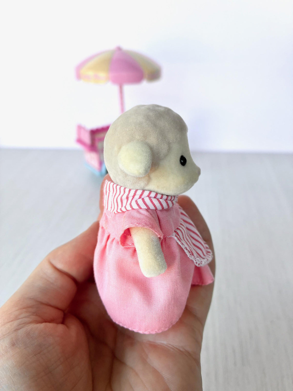 Sylvanian Families Calico Critters Dolly's Candy Floss (Flair 4678) Dolly Dale sheep figure side view in hand