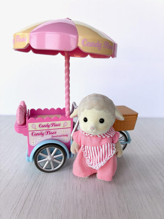 Sylvanian Families Calico Critters Dolly's Candy Floss (Flair 4678) Dolly Dale sheep aunt standing beside her pink candy floss tricycle cart under the umbrella