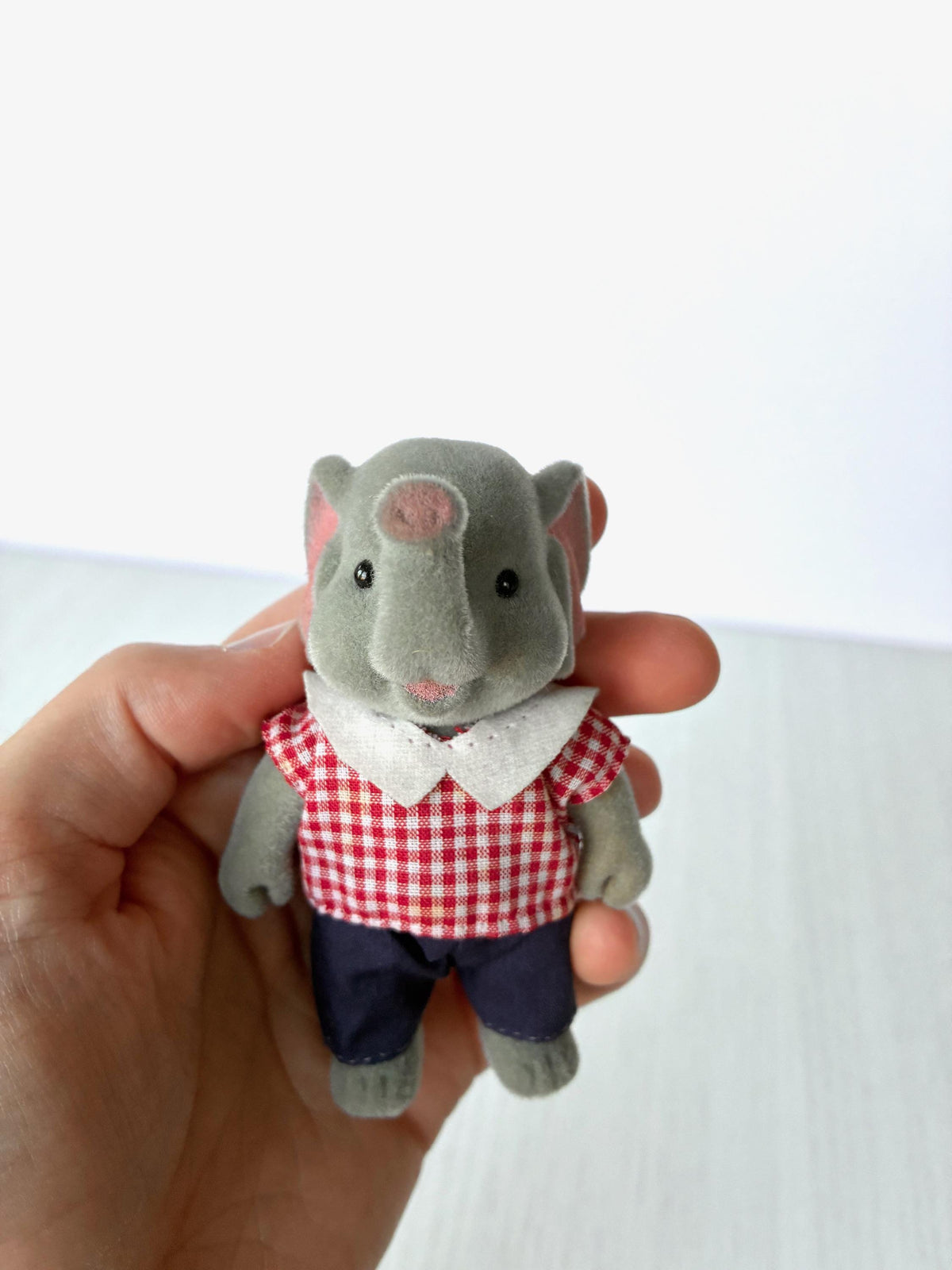 Bärenwald Forest Families elephant father in red gingham shirt and navy trousers, held in hand for scale