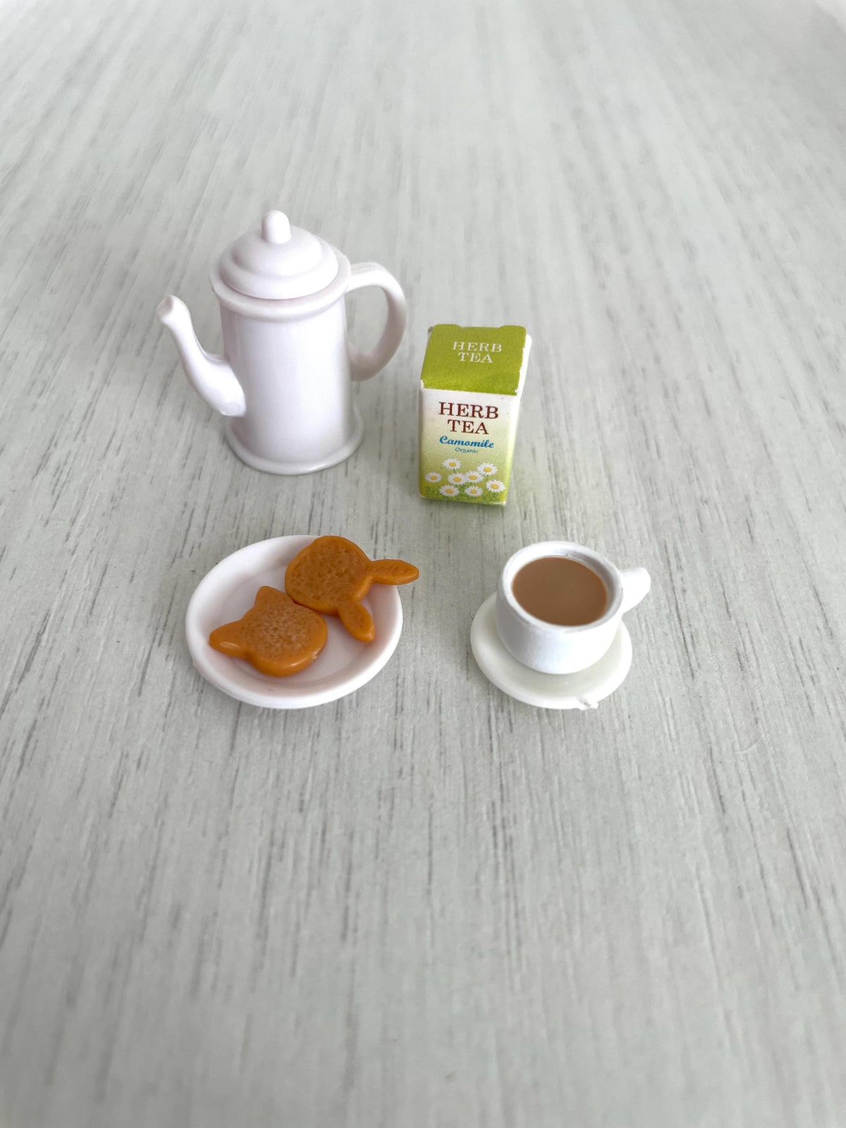 Full tea set with kettle, camomile herb tea box, cat-shaped biscuits and filled teacup — Calico Critters and Sylvanian Families