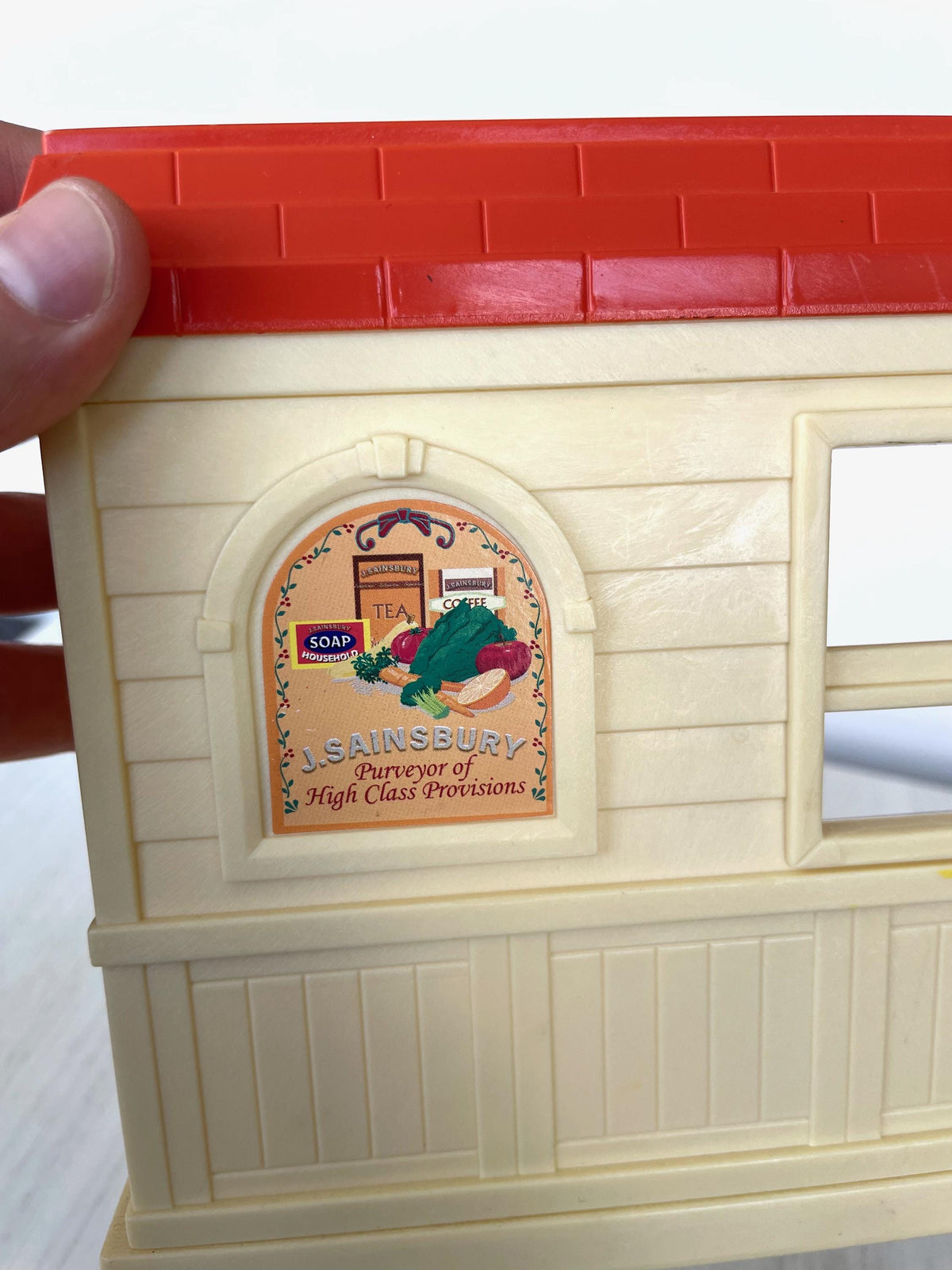 Close up of the J. Sainsbury Purveyor of High Class Provisions side panel, Sylvanian Families Calico Critters