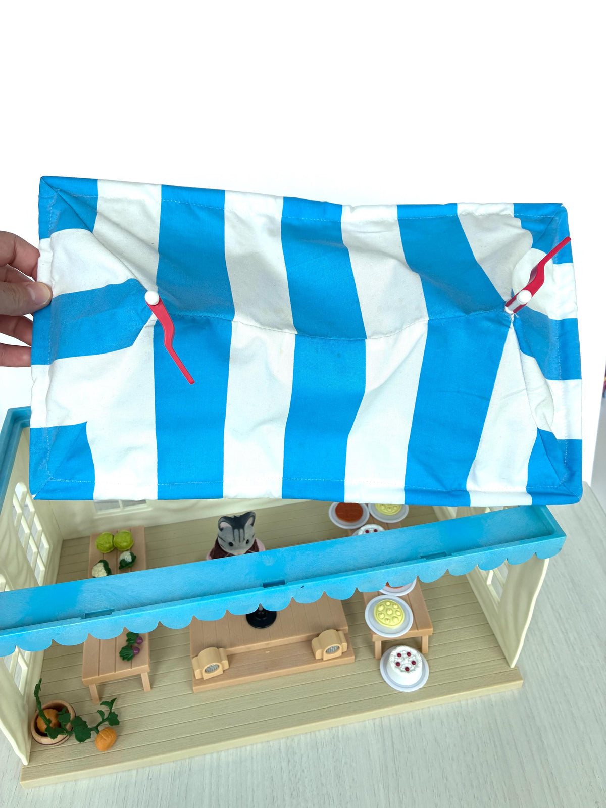 Calico Critters Sylvanian Families Marquee striped fabric roof lifting off to show how the tent comes apart