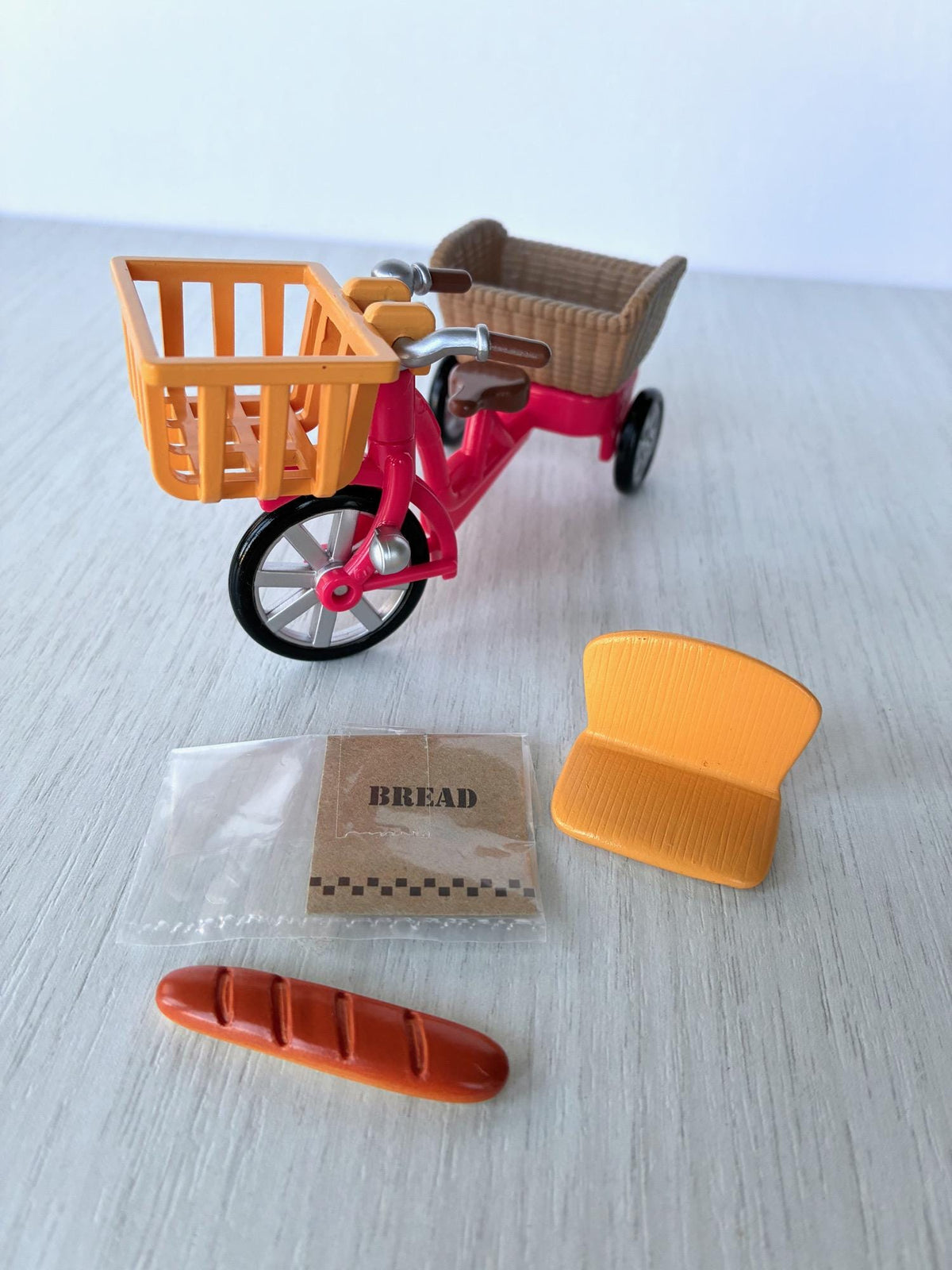 Sylvanian Families Calico Critters red bicycle with orange front basket, rear basket, child seat, baguette and bread bag – photo 2 of 8
