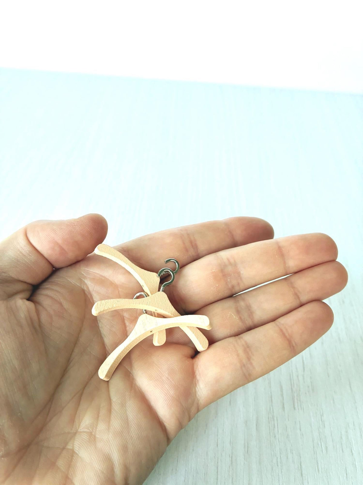 Miniature peach clothes hangers with silver hooks for Calico Critters and Sylvanian Families clothes – photo 3 of 4
