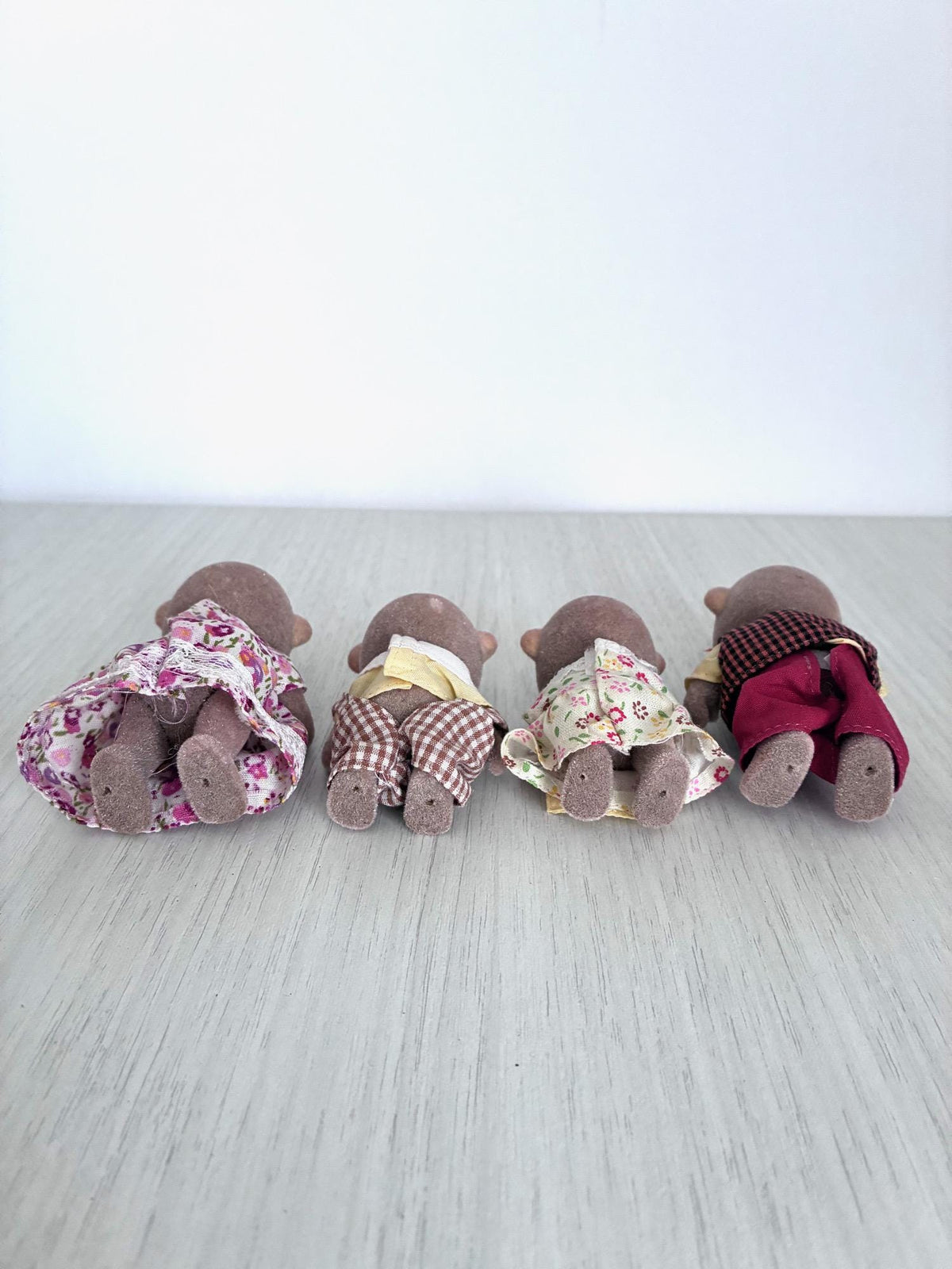Calico Critters Sylvanian Families Monkey Family, back view close up of heads and outfits