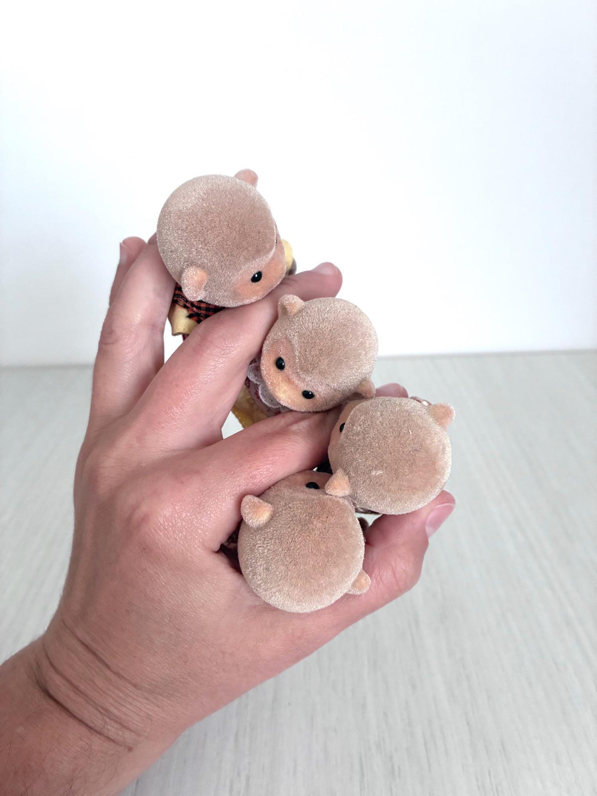 Calico Critters Sylvanian Families Monkey Family, back of heads and ears close up in hand