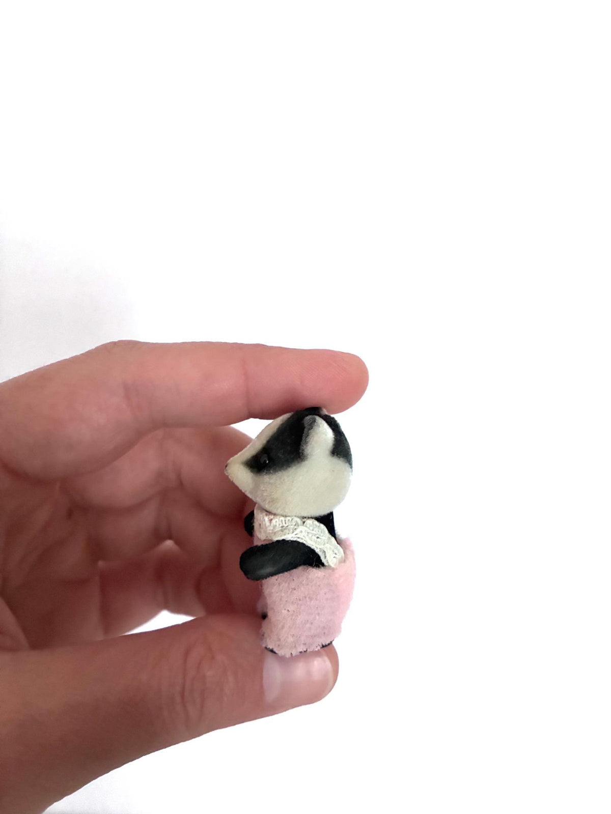 Calico Critters Sylvanian Families badger baby, side back angled view