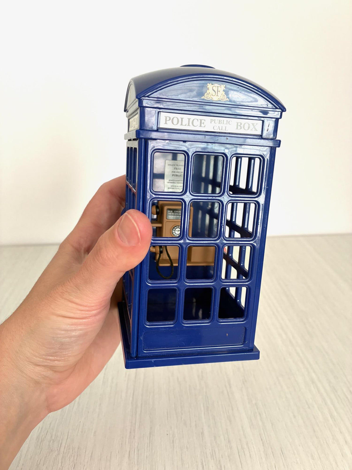 Hand holding Sylvanian Families Police Call Box for scale, Calico Critters vintage Flair accessory