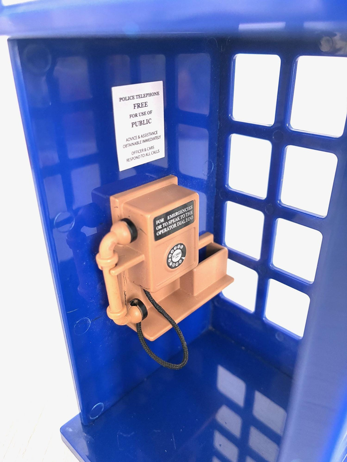Close up of telephone inside Sylvanian Families Police Call Box with Police Telephone notice, Calico Critters vintage detail