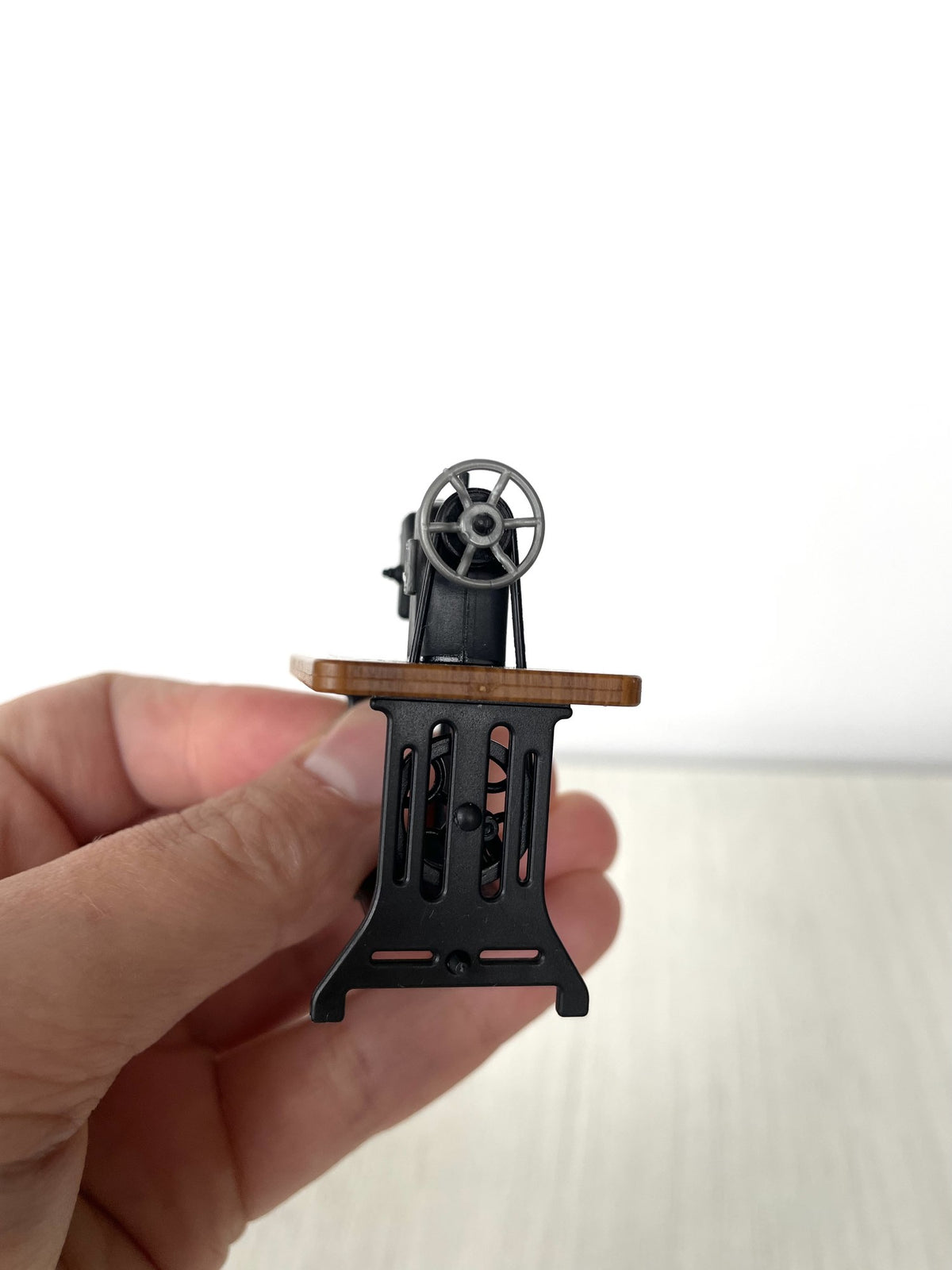 Side view of the sewing machine frame and treadle base — Calico Critters and Sylvanian Families