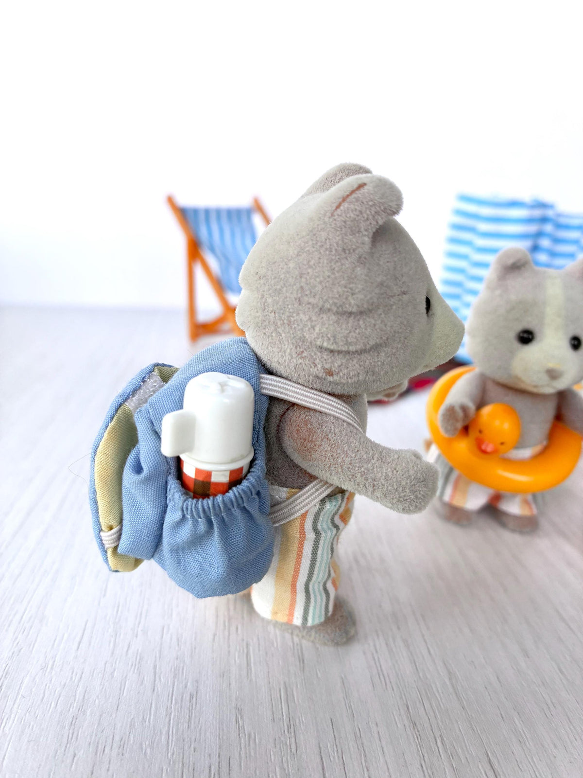 Sylvanian Families Calico Critters Day at the Seaside Set (Flair 4870): Harley Farthing carrying the blue rucksack with flask, Vespa in his duck ring behind
