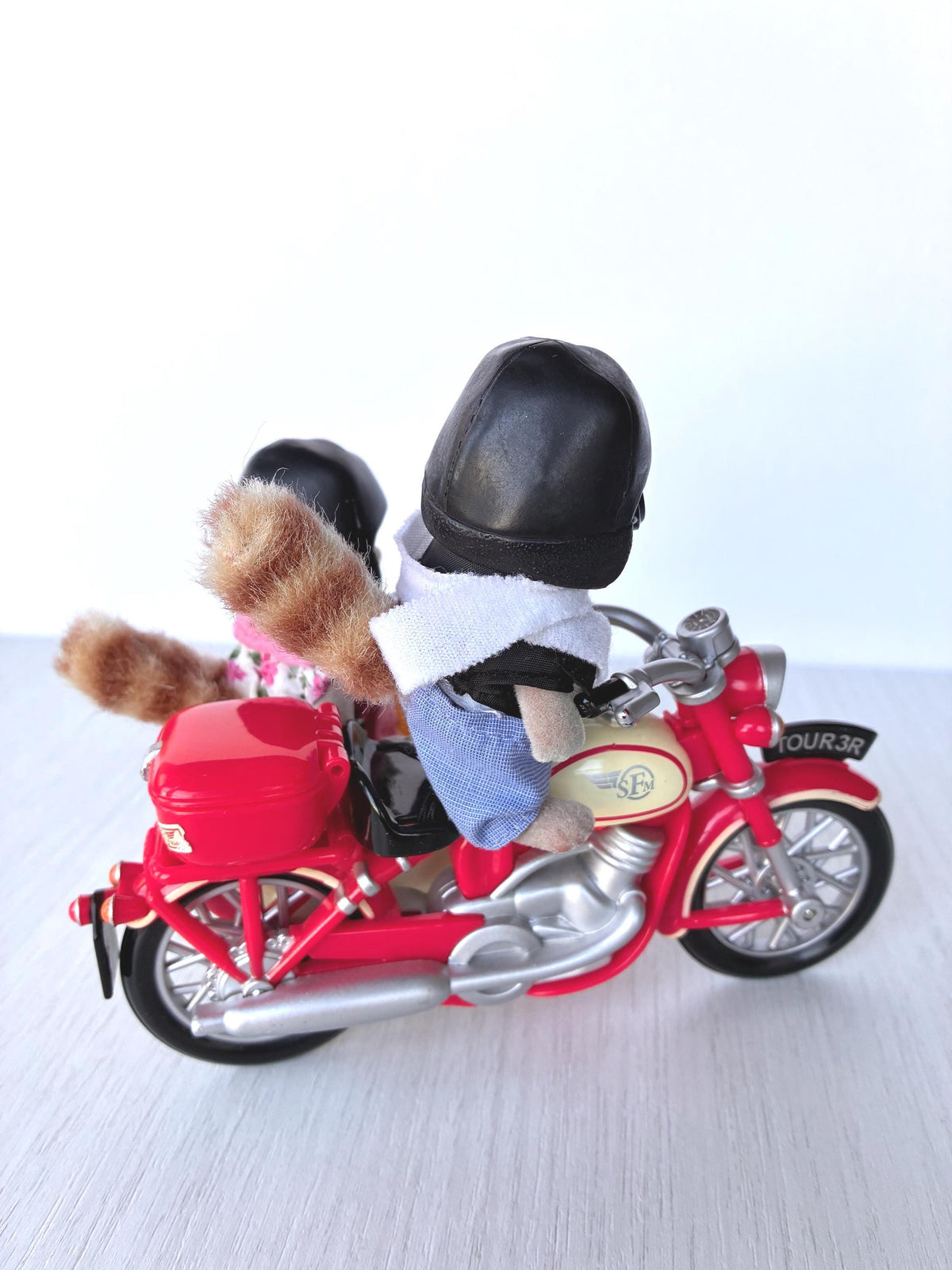 Calico Critters Sylvanian Families George Mulberry Raccoon Grandfather riding the red Motorcycle, side view with striped tail and red top box