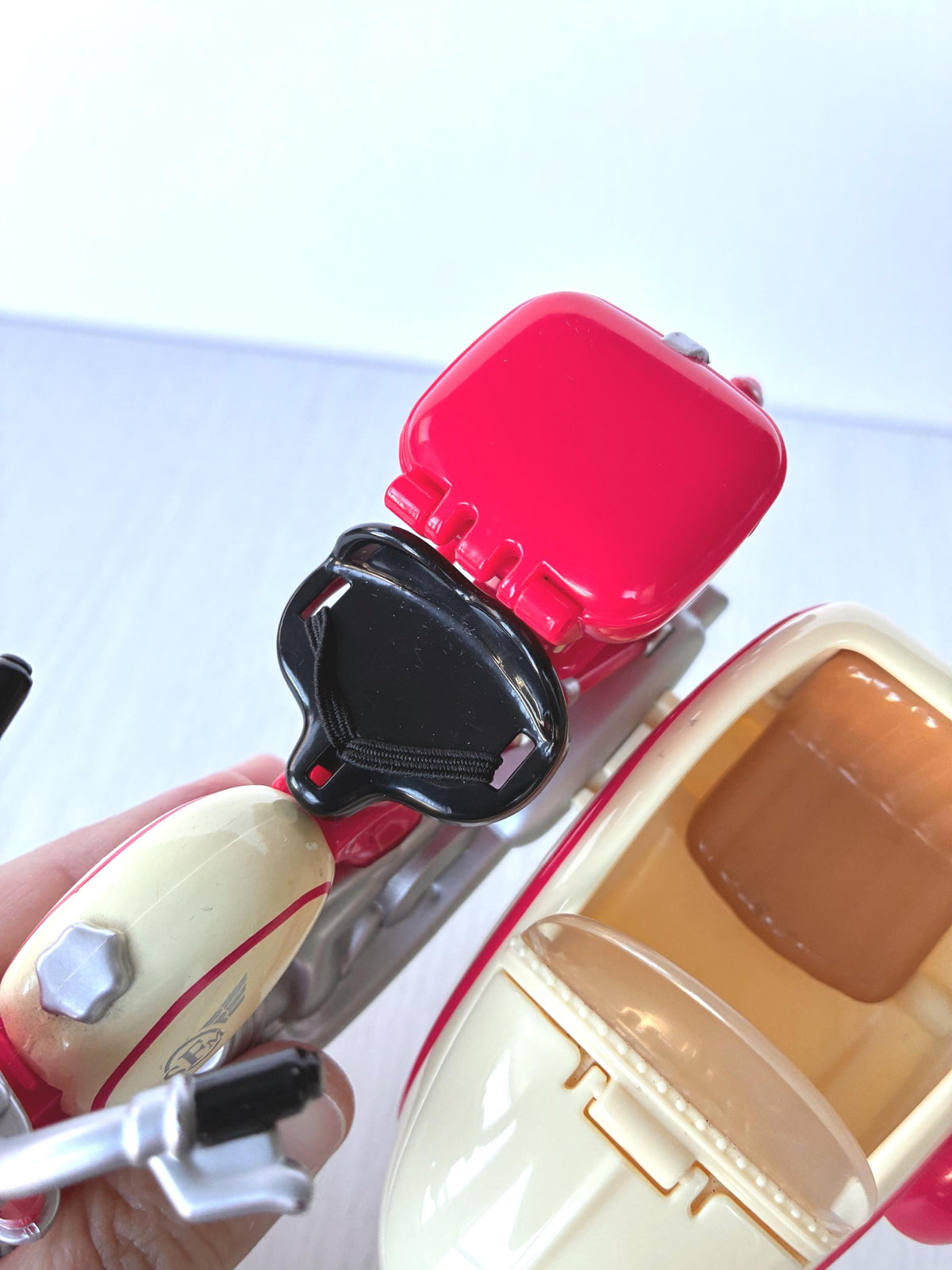 Calico Critters Sylvanian Families Motorcycle and Sidecar overhead close-up of red top box, goggles, cream fuel tank and sidecar seat with clear windscreen