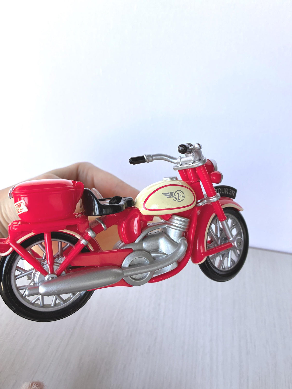 Calico Critters Sylvanian Families red Motorcycle side view showing silver engine, exhaust pipe, spoked wheels, black seat and red top box, Flair 4511